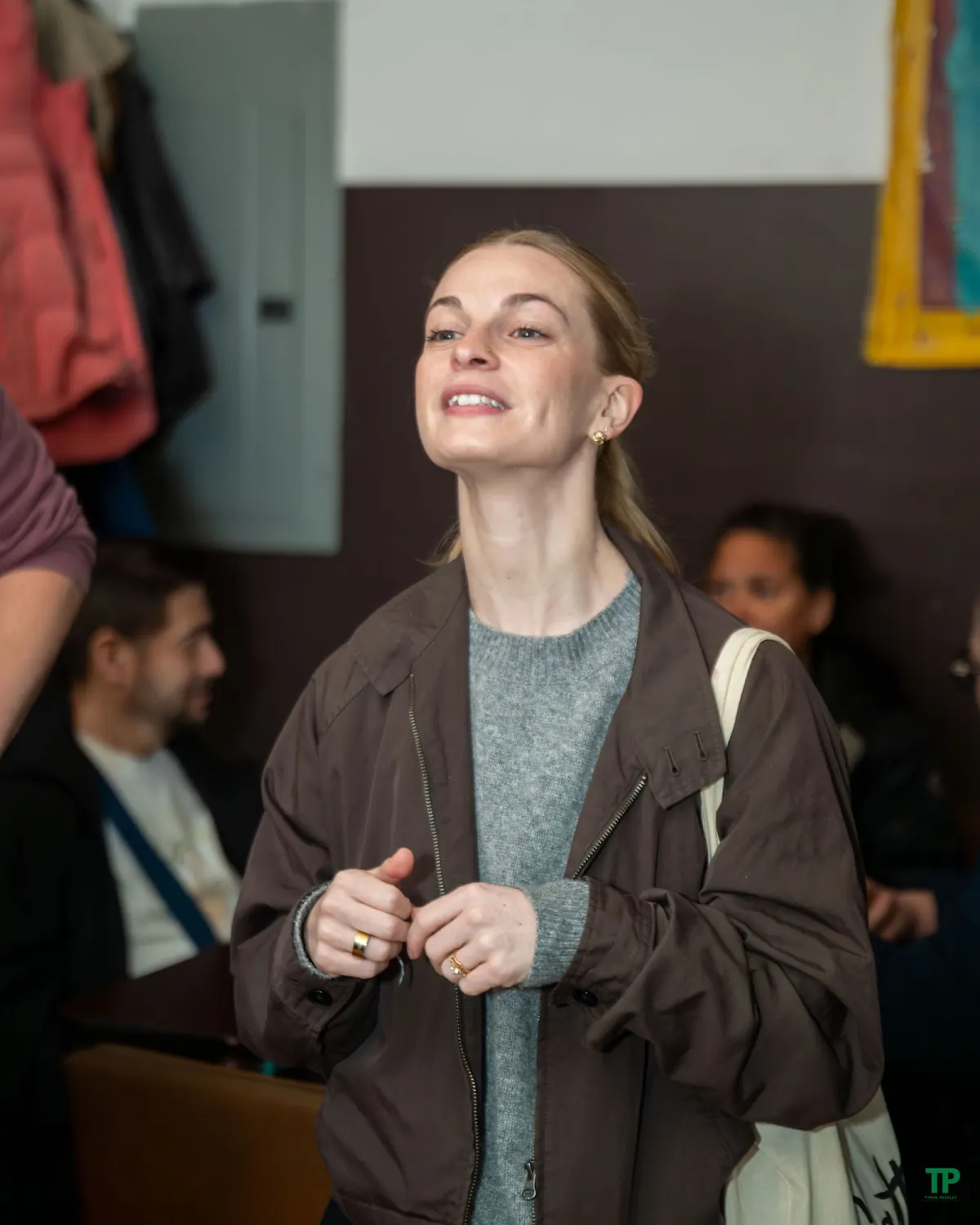 Guest smiling during a candid moment at The Magnet Collective celebration